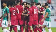 Qatar players celebrate after defeating Bangladesh 5-0 at Al Duhail Stadium on Friday.