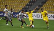 Qatar SC's Mohammed Youcef Belaili (second right) is challenged by Al Sadd's Pedro Miguel during yesterday's QNB Stars League Round 11 match played at Qatar SC Stadium.