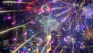 New Year's Eve fireworks erupt over the Chao Phraya river during the fireworks show in Bangkok on January 1, 2021. / AFP / Mladen ANTONOV
