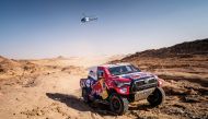 Toyota's Qatari driver Nasser Al Attiyah and navigator MatthieuBaumel in their Toyota Hilux during the third stage of the 2021 Dakar Rally yesterday.