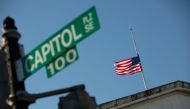 A flag flies at half-mast at the Longworth House Office Building across from the US Capitol building on Capitol Hill in Washington, US, January 10, 2021. Reuters/Allison Shelley