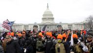 FILE PHOTO: Members of the far-right group Proud Boys make 'OK' hand gestures indicating 