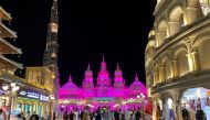 FILE PHOTO: People wear face masks amid the spread of coronavirus disease (COVID-19) at the Global Village in Dubai, United Arab Emirates November 17, 2020. REUTERS/Ahmed Jadallah