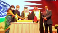 Minister of Commerce and Industry H E Ali bin Ahmed Al Kuwari (centre) cutting a cake along with Ambassador of India H E Dr. Deepak Mittal (second left) and his wife Dr. Alpana Mittal; Director of Protocol at Qatar's Ministry of Foreign Affairs H E Ambass