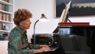 Parisian pianist Colette Maze, 106 years old, plays piano as she poses at her home in Paris, France, February 4, 2021. Maze has been playing the piano since the age of 4, almost one century ago. Today, she is working on yet another album, as performing on