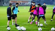 Al Sadd players in action during a practice session as coach Xavi Hernandez looks on.