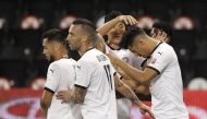 Al Sadd's players celebrate after Baghdad Bounedjah (right) scored team's opening goal yesterday. 