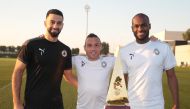 Al Sadd's goalkeeper Saad Al Sheeb, Spanish midfielder Santi Cazorla and Qatari defender Abdelkarim Hassan posing for a photo with the Qatar Cup winner's trophy. Al Sadd are the Qatar Cup title holders.