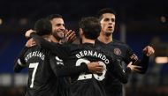 Soccer Football - Premier League - Everton v Manchester City - Goodison Park, Liverpool, Britain - February 17, 2021 Manchester City's Bernardo Silva celebrates scoring their third goal with Riyad Mahrez and teammates Pool via REUTERS/Michael Regan 