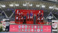 Jan Tops, Founder and President of Longines Global Champions Tour, and Hamad bin Abdul Rahman Al Attiyah, President of the Qatar and Asian Equestrian Federations, posing for a photograph with the podium winners of the Global Champions League Of Doha at Th