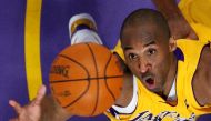 FILE PHOTO: Los Angeles Lakers Kobe Bryant jumps for a rebound against the Denver Nuggets during Game 2 of their NBA Western Conference final basketball playoff game in Los Angeles, California, U.S. May 21, 2009. REUTERS/Lucy Nicholson/File Photo
