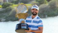 France's Antoine Rozner poses with the Mother of Pearl Trophy after winning the 2021 Commercial Bank Qatar Masters at Education City Golf Club, yesterday.  
Pic: Ebrahim Kutty