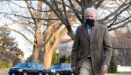 US President Joe Biden walks across the South Lawn of the White House towards reporters, in Washington, US, March 14, 2021. Reuters/Cheriss May