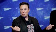 FILE PHOTO: SpaceX owner and Tesla CEO Elon Musk grimaces after arriving on the red carpet for the Axel Springer award, in Berlin, Germany, December 1, 2020. REUTERS/Hannibal Hanschke/Pool/File Photo/File Photo
