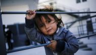 An asylum-seeking migrant girl from Central America, who was airlifted from Brownsville to El Paso, Texas, and deported from the U.S. with her mother, looks on outside the office of the Center for Integral Attention to Migrants (CAIM) in Ciudad Juarez, Me