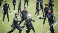 Qatar players take part in a training session in Debrecen, Hungary, yesterday as they gear up for today's 2022 FIFA World Cup European qualifier against Luxembourg.  