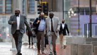 Floyd family lawyer Ben Crump and members of the Floyd family walking outside the Hennepin County Government Center on the seventh day in the trial of former police officer Derek Chauvin, who is facing murder charges in the death of George Floyd, in Minne