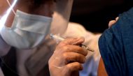 A person receives a dose of the Johnson & Johnson coronavirus disease (COVID-19) vaccine during a visit of U.S. Vice President Kamala Harris to a vaccination center in Chinatown, in Chicago, Illinois, U.S., April 6, 2021. Picture taken April 6, 2021. REUT