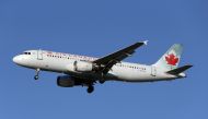 FILE PHOTO: FILE PHOTO: An Air Canada Airbus A320-200 airplane prepares to land at Vancouver's international airport in Richmond, British Columbia, Canada, February 5, 2019. REUTERS/Ben Nelms/File Photo