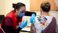 Nurse Venus Lucero administers the first Pfizer-BioNTech COVID-19 vaccine at the Civic Hospital to Jo-Anne Miner at a vaccination clinic in Ottawa, Ontario, Canada December 15, 2020. Adrian Wyld/Pool via REUTERS