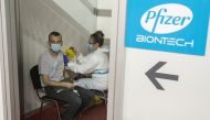 A man receives a second dose of the Pfizer-BioNTech vaccine against the coronavirus disease (COVID-19) at the hall three of the Belgrade Fair, in Belgrade, Serbia, April 13, 2021. REUTERS/Marko Djurica/File Photo