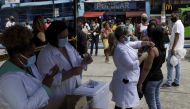 File photo: A citizen receives a dose of the AstraZeneca coronavirus disease (COVID-19) vaccine, during a vaccination day for 57-year-old and older citizens, in Duque de Caxias near Rio de Janeiro, Brazil April 21, 2021. Reuters/Ricardo Moraes/File Photo