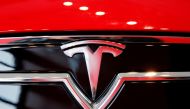 FILE PHOTO: A Tesla logo on a Model S is photographed inside of a Tesla dealership in New York, U.S., April 29, 2016. REUTERS/Lucas Jackson//File Photo
