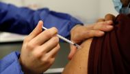 File photo: A medical worker administers a dose of the 