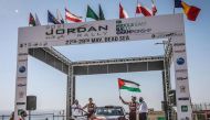Nasser Saleh Al Attiyah
holds the Palestinian flag
ahead of Jordan Rally.