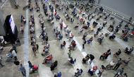 People wait to receive coronavirus disease (COVID-19) vaccines at a vaccination centre in Kuala Lumpur, Malaysia May 31, 2021. REUTERS/Lim Huey Teng
