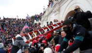 Pro-Trump protesters storm into the U.S. Capitol during clashes with police, during a rally to contest the certification of the 2020 U.S. presidential election results by the U.S. Congress, in Washington, U.S, January 6, 2021. REUTERS/Shannon Stapleton/Fi