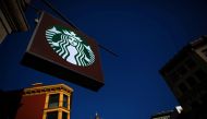 The sign of a Starbucks store is seen in New York January 24, 2014. REUTERS/Eric Thayer/File Photo