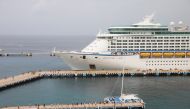 Tourists disembark from the cruise ship Adventure of the Seas, operated by Royal Caribbean International, the first cruise ship carrying tourists to Cozumel since the outbreak of the coronavirus disease (COVID-19) pandemic in March 2020, in Cozumel, Mexic