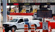 A US Customs and Protection vehicle stands beside a sign reading that the border is closed to non-essential traffic at the Canada-United States border crossing at the Thousand Islands Bridge, to combat the spread of the coronavirus disease (COVID-19) in L