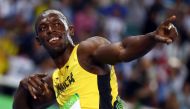 Usain Bolt (JAM) of Jamaica celebrates after winning gold. REUTERS/Kai Pfaffenbach