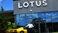 Managing Director of Lotus, Matt Windle stands with a yellow Lotus Esprit car during an interview with Reuters at the car plant headquarters in Hethel, Britain June 23, 2021. Picture taken June 23, 2021. REUTERS/Dylan Martinez
