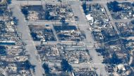 The charred remnants of homes and buildings, destroyed by a wildfire on June 30, are left behind in Lytton, British Columbia, Canada July 6, 2021, as seen in this aerial photograph. REUTERS/Jennifer Gauthier/File Photo