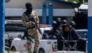 An armed Haitian Army troop guards the entrance of the General Directorate of the police where the suspects of the assassination of Haiti's President Jovenel Moise are detained, in Port-au-Prince, Haiti July 10, 2021. REUTERS/Ricardo Arduengo