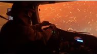 Firefighter crew drives through wildfire embers on their way to protect a housing development from the Tamarack Fire, in Douglas County, Nevada, U.S., July 21, 2021 in this still image taken from video. UC Davis Fire Dept via REUTERS