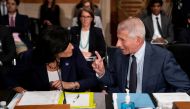 Dr. Anthony Fauci, director of the National Institute of Allergy and Infectious Diseases, speaks to Rochelle Walensky, Director of the Centers for Disease Control and Prevention, prior to a Senate Health, Education, Labor, and Pensions Committee hearing o