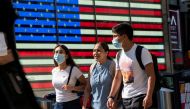 People wear masks around Times Square, as cases of the infectious coronavirus Delta variant continue to rise in New York City, New York, U.S., July 23, 2021. REUTERS/Eduardo Munoz
