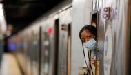 An MTA worker is seen wearing a mask on the subway after The Port Authority of New York and New Jersey and the Metropolitan Transportation Authority (MTA) announced a mandatory coronavirus vaccination or weekly test mandate for employees in New York City,