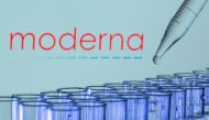 Test tubes are seen in front of a displayed Moderna logo in this illustration taken, May 21, 2021. REUTERS/Dado Ruvic/Illustration//File Photo