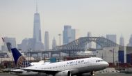 A United Airlines passenger jet takes off with New York City as a backdrop, at Newark Liberty International Airport, New Jersey, U.S. December 6, 2019. REUTERS/Chris Helgren/File Photo