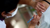 A health worker injects a dose of the Sputnik V (Gam-COVID-Vac) vaccine at a COVID-19 vaccination center in Buenos Aires, Argentina August 6, 2021. Reuters/Agustin Marcarian