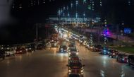 Travellers line up to enter Canada after border restrictions were loosened to allow fully vaccinated U.S. residents, after the coronavirus disease (COVID-19) pandemic forced an unprecedented 16-month ban, at the Thousand Islands Bridge crossing in Lansdow