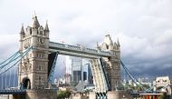 Tower Bridge is seen stuck in the open position, due to a technical fault, in London, Britain, August 9, 2021. Reuters/Henry Nicholls
