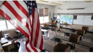 FILE PHOTO: Social distancing dividers for students are seen in a classroom at St. Benedict School, amid the outbreak of the coronavirus, in Montebello, near Los Angeles, California, July 14, 2020. REUTERS/Lucy Nicholson/File Photo
