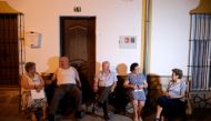 Neighbours chat outside their houses to avoid the heat at night, as a heatwave hits Spain, in Algar, August 12, 2021. Picture taken August 12, 2021. REUTERS/Jon Nazca