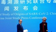 Peter Ben Embarek and Marion Koopmans, members of the World Health Organization (WHO) team tasked with investigating the origins of the coronavirus disease (COVID-19), arrive for the WHO-China joint study news conference at a hotel in Wuhan, Hubei provinc